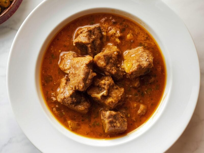 Lamb Rogan Josh with tender meat in a rich red sauce, a classic from Kashmir in 10 Indian curry recipes