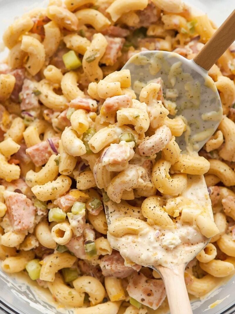 Stir with mayo, a little mustard, diced celery, red onion, pickle relish, salt, and black pepper.