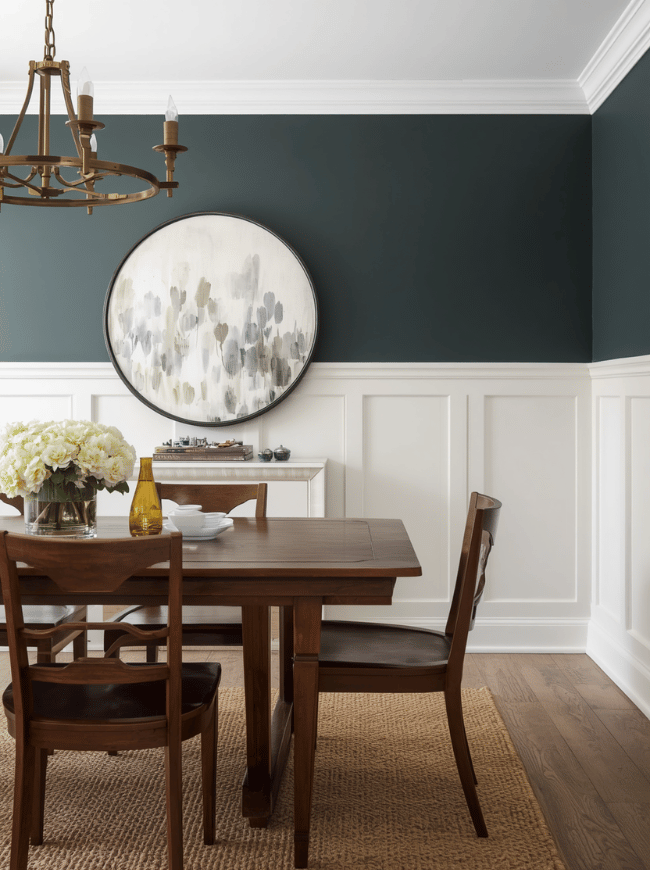 Create a Dining Room Accent Wall An accent wall is one of the easiest ways to add character without redecorating the whole room. Paint, wallpaper, decorative paneling, wood slats, and textured finishes can all create a strong backdrop for the dining table. A deep green, navy, charcoal, or warm brown can make a large dining room feel more intimate. In a narrow or poorly lit room, a soft cream, pale green, or warm beige may help the space feel brighter. Wallpaper with a botanical, geometric, or subtle textured pattern can also bring interest to an otherwise plain room. Choose one main wall, such as the wall behind a sideboard or the wall facing the entrance. Keeping the remaining walls simpler prevents the room from feeling crowded and allows the accent wall to stand out.